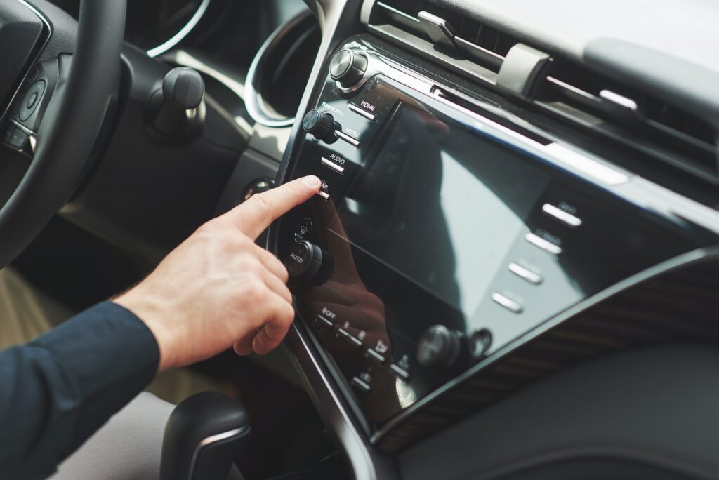 Man includes an audio system in the car