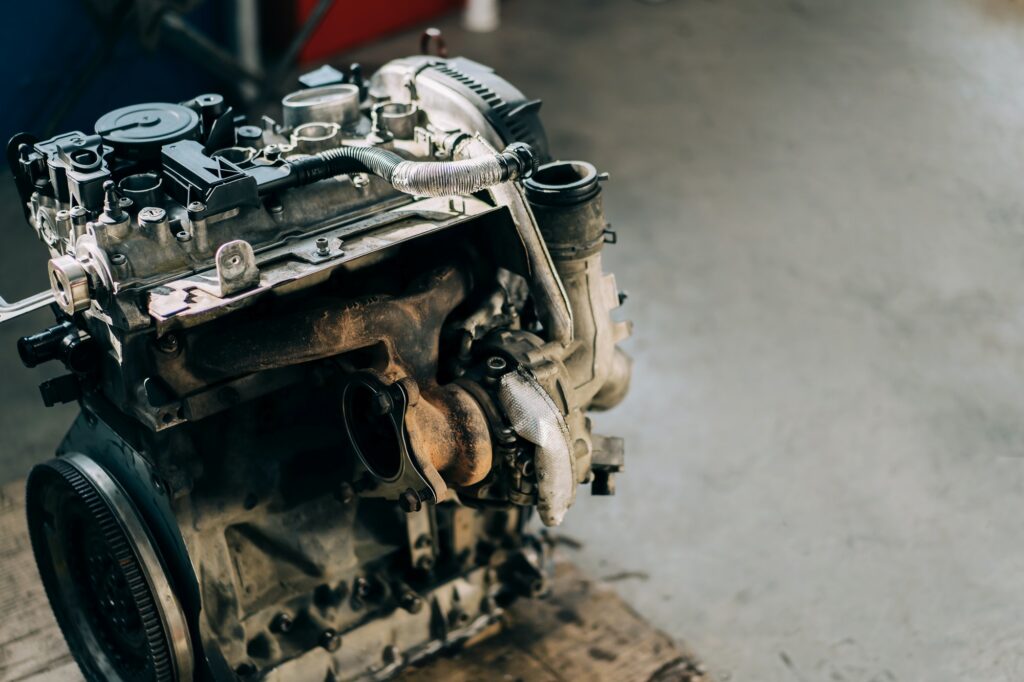 The internal combustion engine is assembled on the floor. Car engine repair and purchase